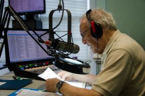 Volunteer reader recording in sound studio at North Carolina Reading Service